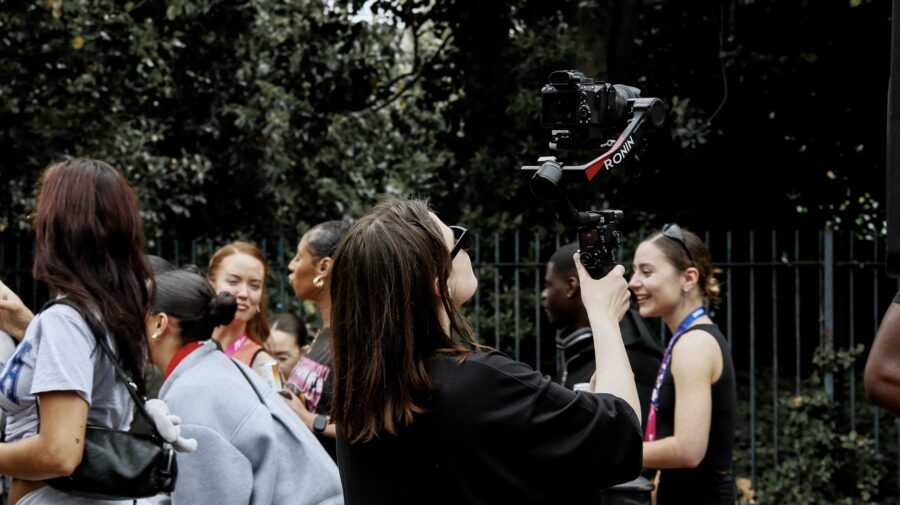 Ana filming the crowd on a gimbal